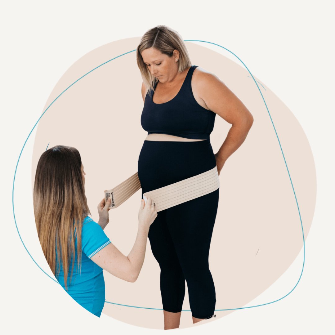 A pregnant lady being measured for a Plus size belly band.